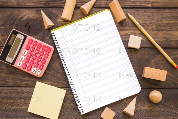 Calculator geometric figures near stationery