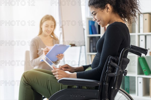 Close up adult woman holding tablet