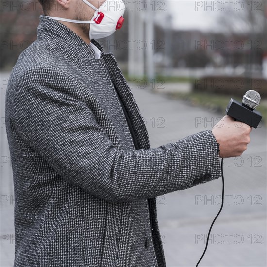 Close up journalist man with mask