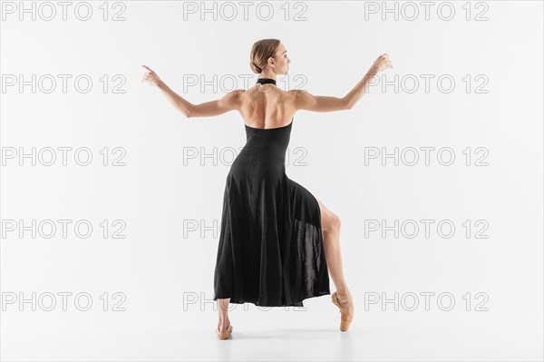 Full shot woman wearing pointe shoes dress