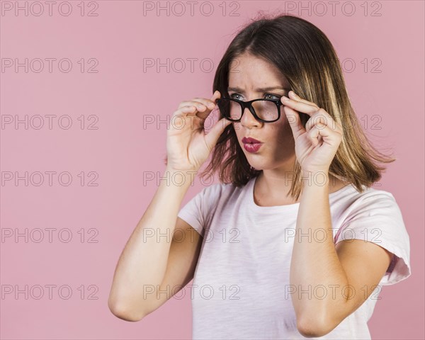 Medium shot surprised girl with glasses