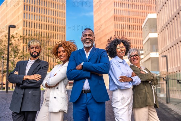 Formal portrait of a multi-ethnic business team standing proud outdoors in the financial district