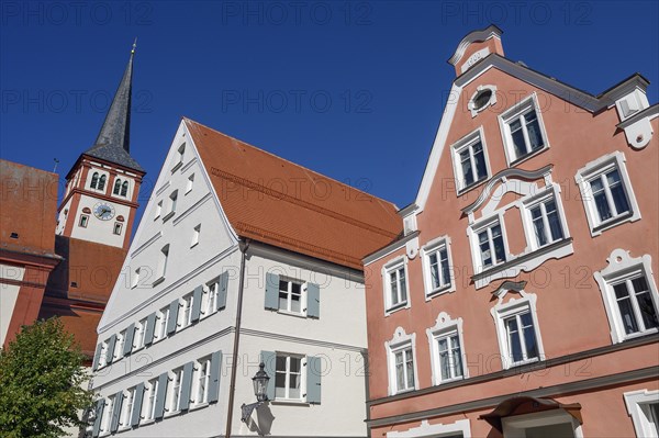 Pink facade and tower of the parish church of St Stephan