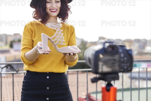 Brunette blogger showing heel camera 2