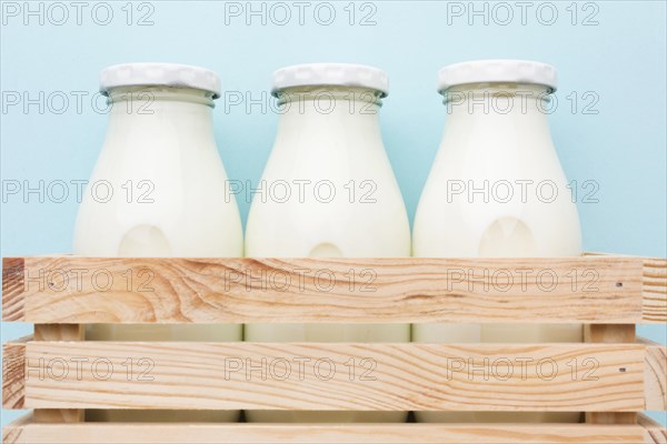 Close up fresh bottles milk ready be served