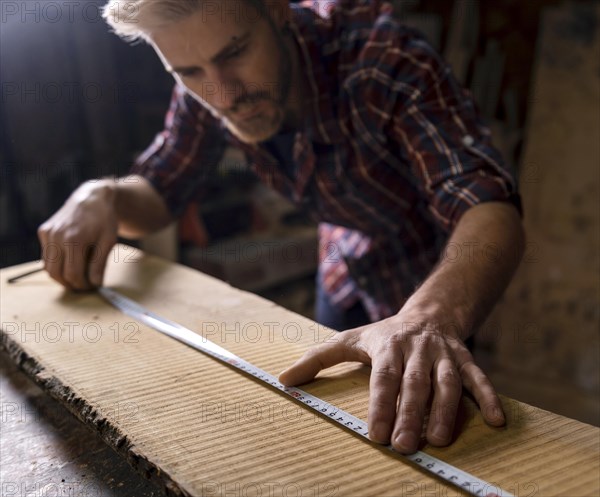 Close up man working with wood 2