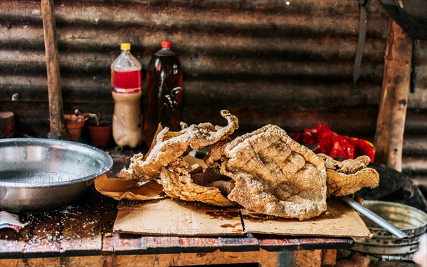 Homemade Nicaraguan chicharron served on table. Close up of homemade chicharron on the table