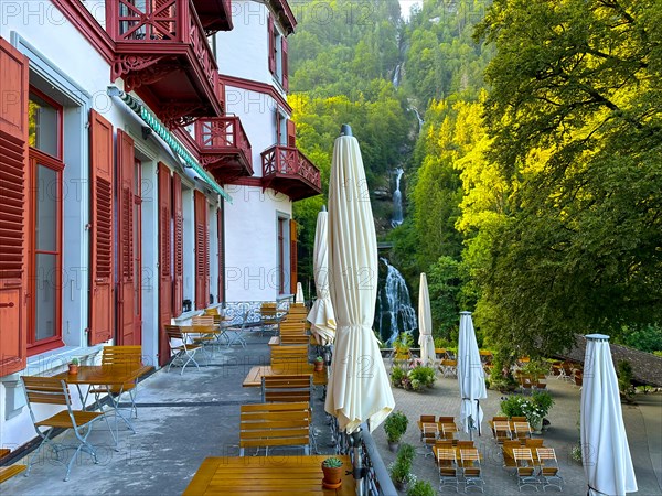 Grandhotel Giessbach with Terrace View over Giessbach waterfall in a Sunny Summer Day in Brienz