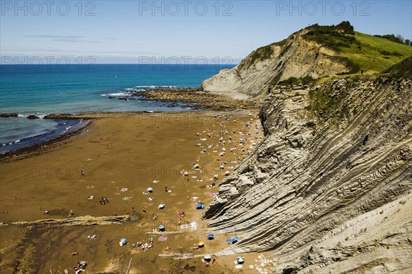 People on the beach and rocks