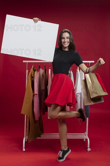 Beautiful woman holding empty banner