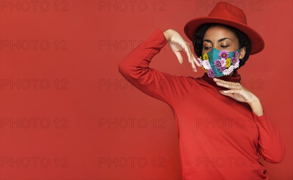 Front view woman with flowers mask