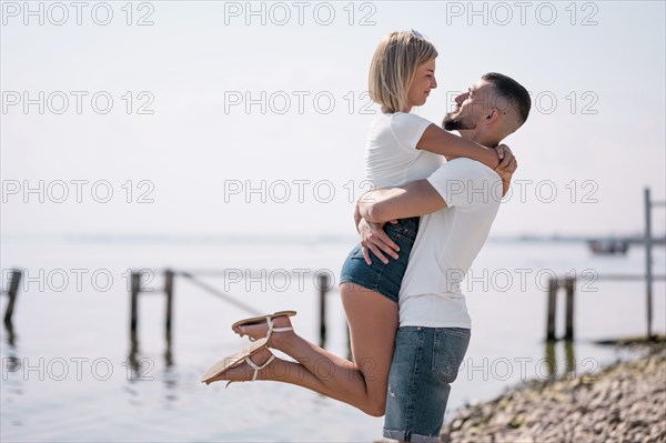 Happy couple hanging out together beach