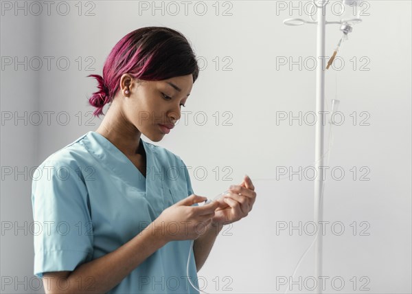 Medium shot woman adjusting perfusion