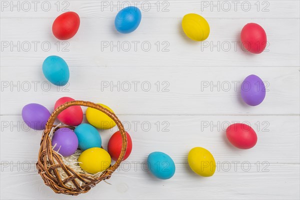 Frame from easter eggs basket wooden table