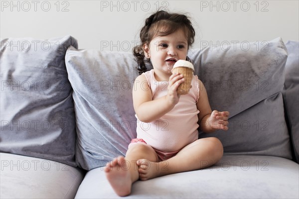 Front view adorable young girl sofa