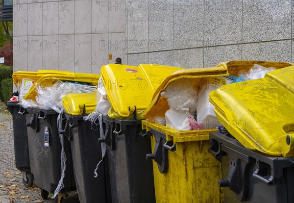 Dumpster overfilled with plastic film