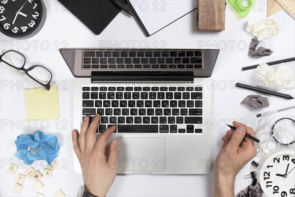 Overhead view businessman using digital tablet office desk