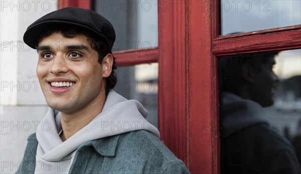 Close up smiley man wearing hat