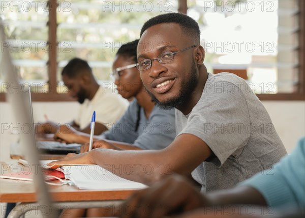 Close up students learning class