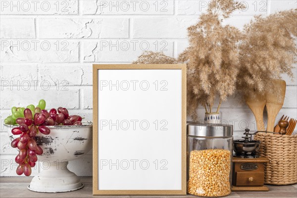 Blank frame shelf beside flower pots