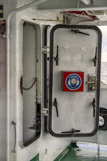 Steel door to the engine room on an excursion boat