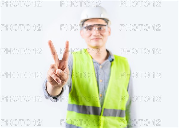 Young engineer counting number two isolated. Male engineer showing number two isolated