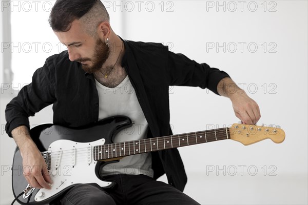 Front view musician playing electric guitar