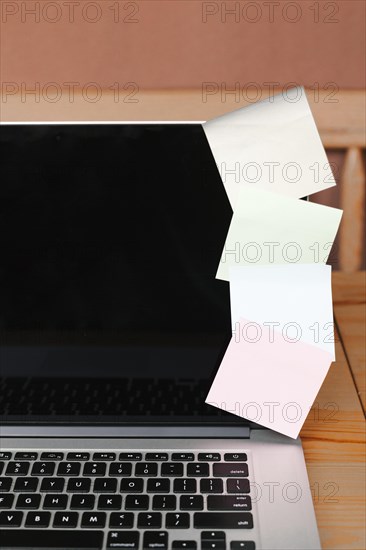 Closeup with laptop sticky notes
