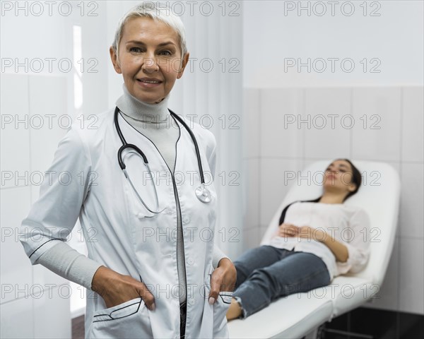 Female doctor posing patient