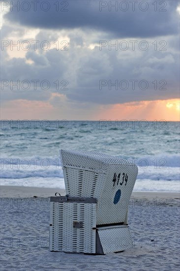 White beach chair in the evening sun