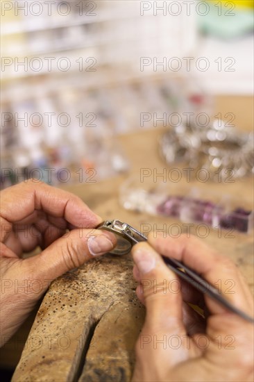 Creating ring hard working jeweler concept