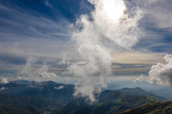 Aerial View over Beautiful Mountainscape with Clouds in a Sunny Day From Monte Generoso