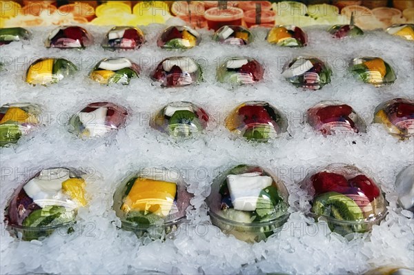 Freshly cut and ready-to-cook fruit in plastic cups