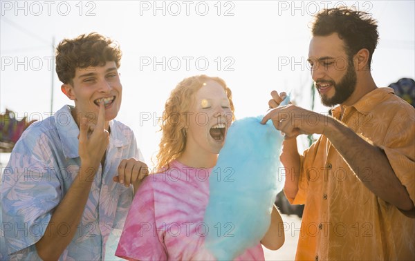 Group friends eating cotton candy