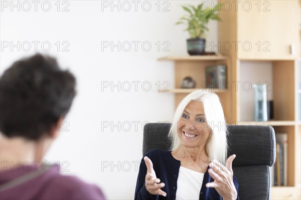 Therapist talking to a patient in a practice