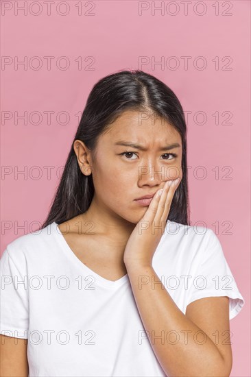 Black hair woman frowning looking camera