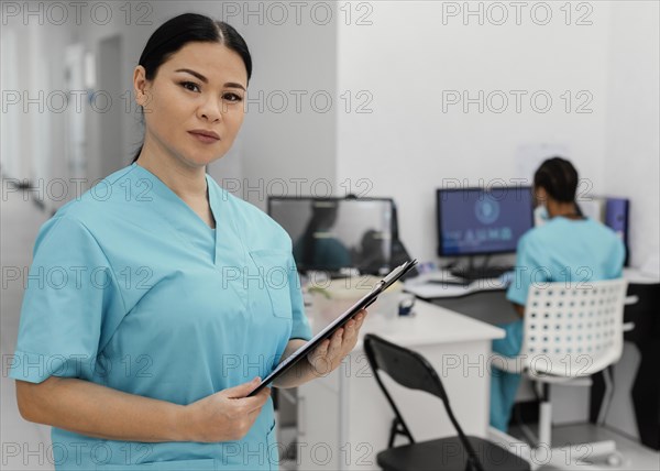 Medium shot health workers indoors