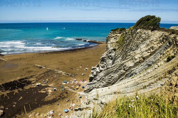 People on the beach and rocks