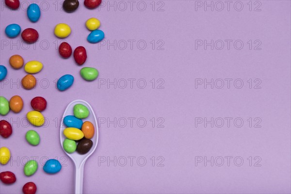 Flat lay frame with candy spoon