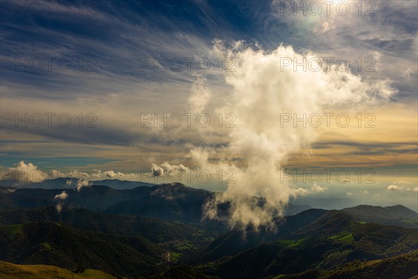 Aerial View over Beautiful Mountainscape with a Cloud in Sunset From Monte Generoso