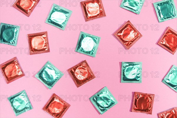 Flat lay condoms red green wrappers