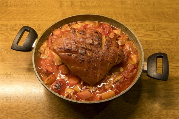 Finished roast pork in a roasting pan