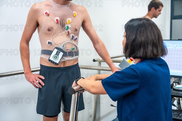 Cardiologist and doctor talking after performing a cardiovascular stress test in a clinic