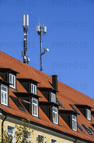 Rores tiled roof with dormers and antennas