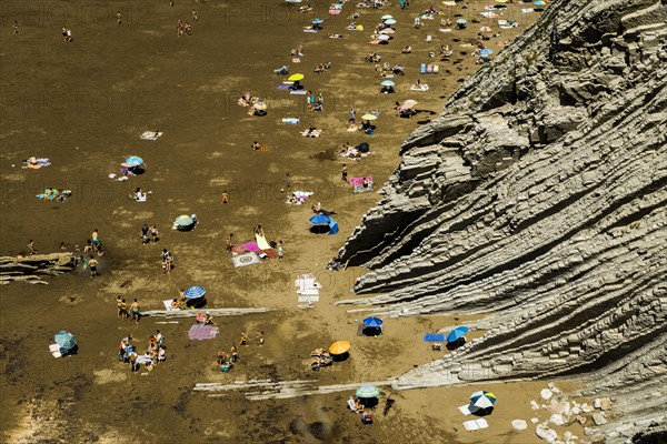 People on the beach and rocks