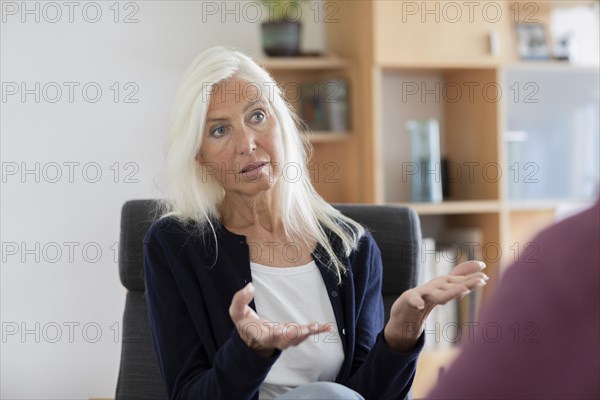 Therapist talking to a patient in a practice