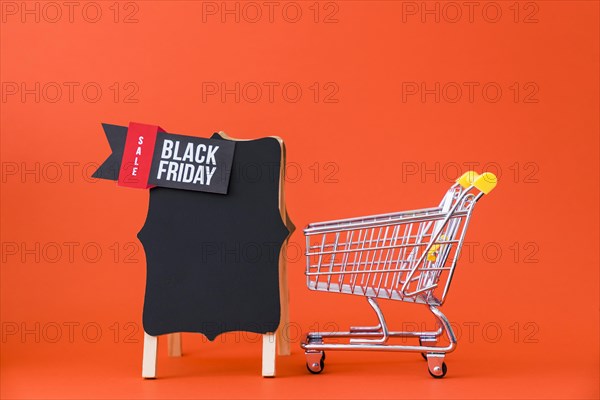 Black friday decoration with small cart board