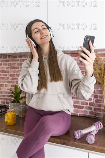 Medium shot woman with headphones