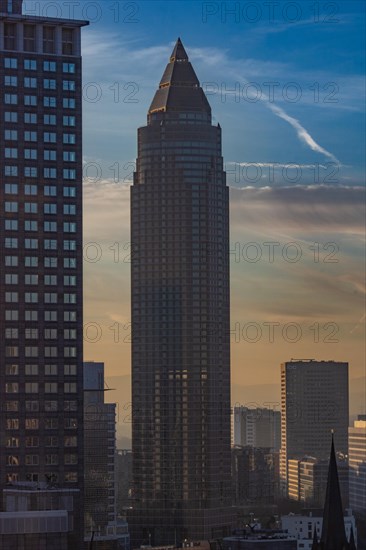 Sunset between skyscrapers. Cityscape with modern office buildings and streets. Insurance companies and banks as a cityscape in Frankfurt am Main