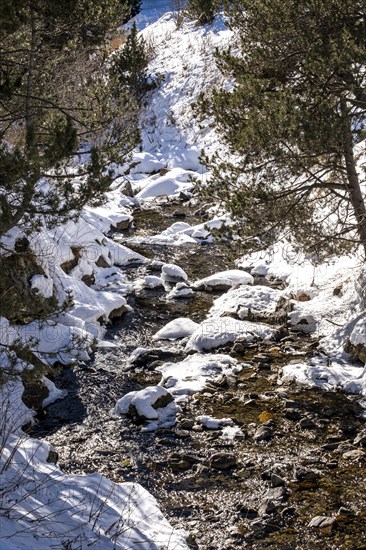 Winter landscape with snow in the snowy mountains of the Pyrenees of Andorra